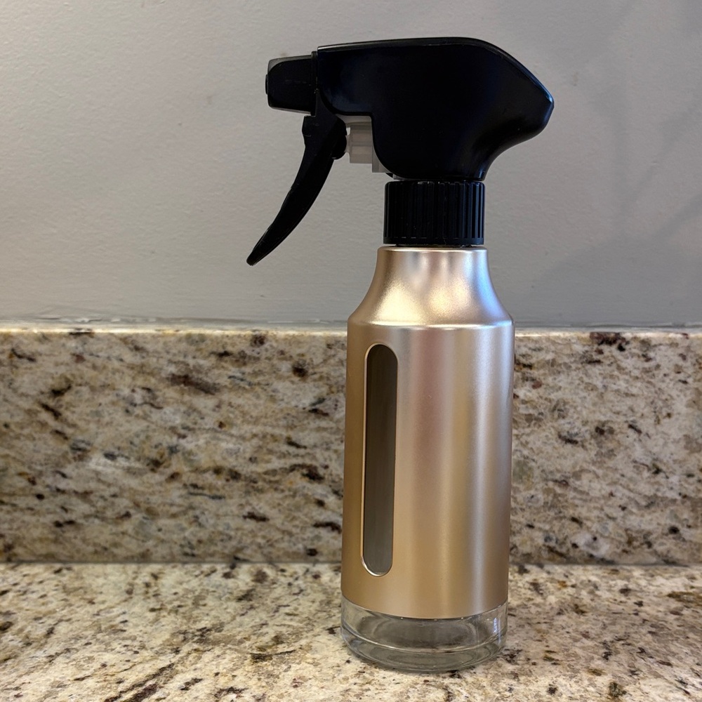 Stylish Gold and Black Spray Bottle
